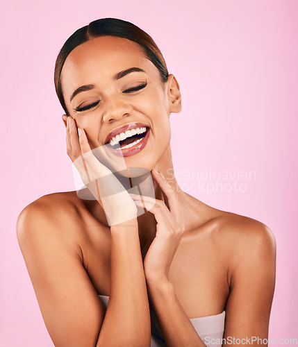 Image of Funny, smile and woman with skincare, beauty and dermatology against a pink studio background. Female person, humor or happy model with makeup, wellness and facial with luxury, laughing and aesthetic