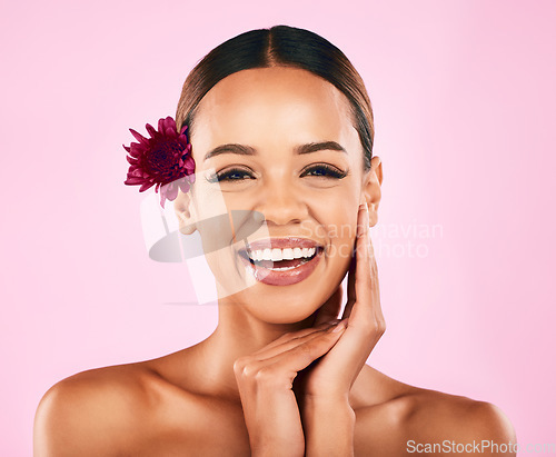 Image of Natural beauty, flower and portrait of woman with makeup, wellness and skin care glow on pink background. Cosmetics, organic dermatology and model with luxury facial care and healthy spa in studio.