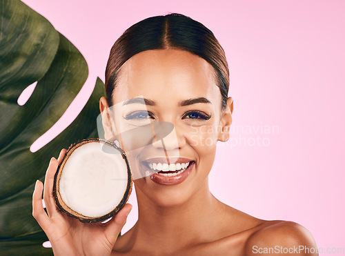 Image of Fruit, coconut and portrait of woman with skincare, beauty and cosmetics for natural or vegan facial care, dermatology or treatment. Smile, happy and healthy girl with product, cream or moisturizer