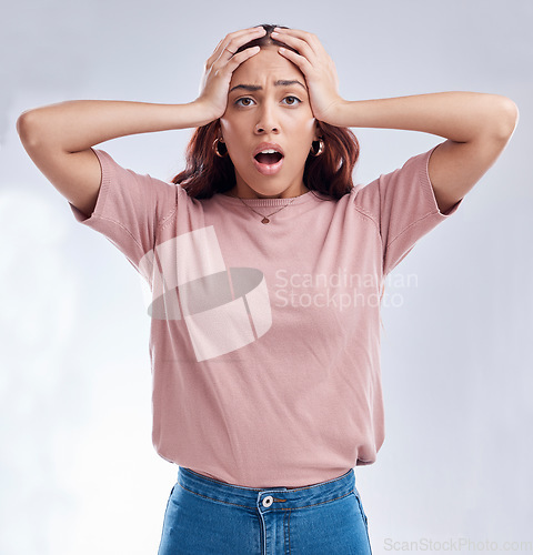 Image of Woman with hands on head, surprise and stress, reaction in portrait with disaster isolated on white background. Crisis, mistake and fail, female person with problem and wow expression in a studio