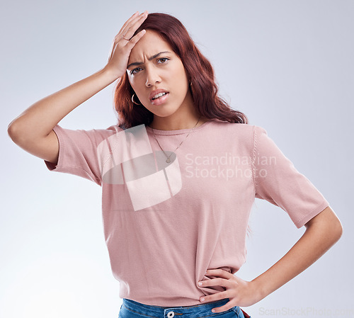 Image of Regret, mistake and young woman in studio with hand on head for anxiety, stress or panic. Portrait of a frustrated female model person on a white background with doubt, stress and problem or fail