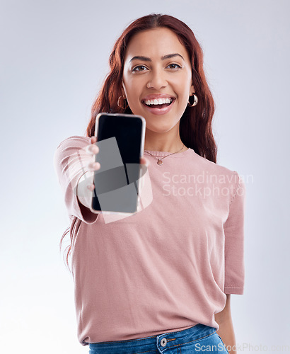 Image of Woman in portrait, phone screen with mockup and advertising, mobile app ads on white background. Website promo, logo design marketing and female brand ambassador with social media branding in studio