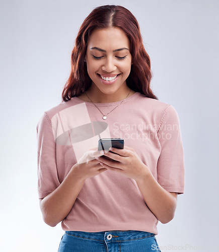 Image of Studio, phone or happy woman on social media typing or texting on web chat for online dating. Smile, scroll or gen z female model browsing on mobile, internet or website isolated on white background