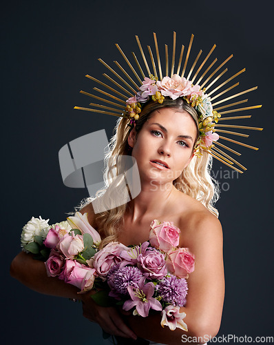 Image of Woman, spring goddess and studio portrait with flowers, beauty and crown for new beginning by black background. Girl, model and bouquet with plants, makeup and aesthetic for growth with cosmetics