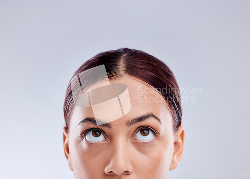 Image of Looking up, mockup or woman thinking of idea in studio isolated on white background to promote beauty. Marketing, natural glowing skincare or face of female model with mock up space for advertising