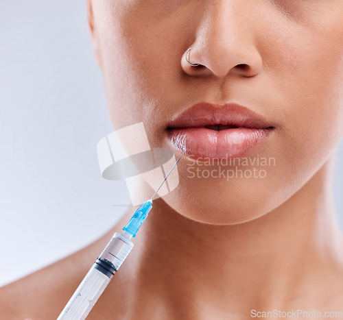 Image of Lip filler, injection and beauty, woman and cosmetic surgery with face closeup isolated on white background. Skincare, liquid collagen and female model, skin and syringe with dermatology in studio