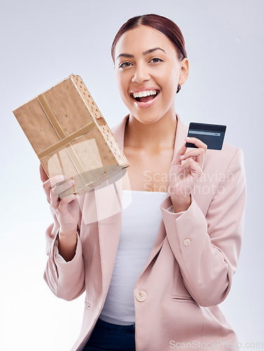 Image of Gift, portrait and happy woman with credit card in studio, wow and smile for cashback gift on grey background. Customer, reward and female face with box present promotion for retail, sale or payment