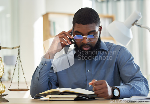 Image of Phone call, reading and notebook with a black man lawyer reading information for a legal case or trial. Mobile, communication and research with a male attorney in his office learning about the law