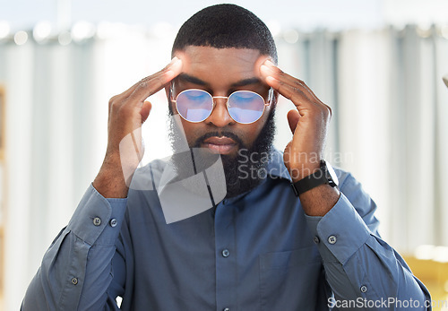 Image of Business, stress and black man with a headache, burnout and audit deadline with health problem, overworked and painful. Male person, employee and agent with a migraine, medical issue and emergency