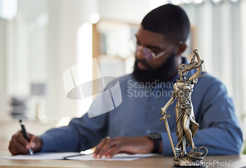 Image of Lawyer, office and man at desk with statue of justice, contract or documents for court schedule. Consultant, law firm attorney or judge with signature paperwork for legal agreement or deal in Africa.