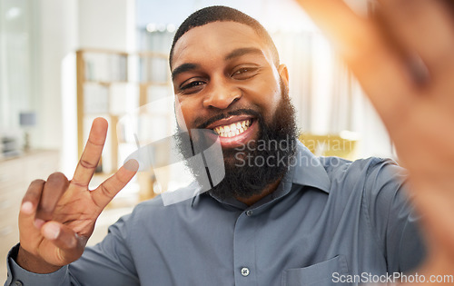 Image of Smile, business man and selfie with a peace sign and face of influencer person at work. Portrait of a black guy or entrepreneur with job satisfaction and pride for social media profile picture update