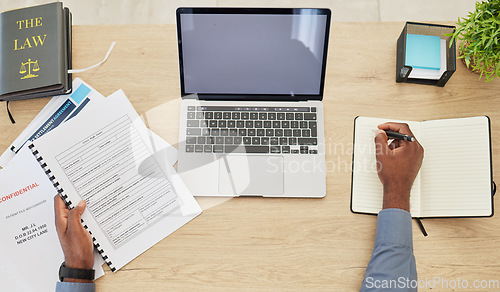 Image of Research, mockup and laptop screen with hands of lawyer in office for writing, justice and legal documents. Books, website and advocate with closeup of person in office for attorney and technology