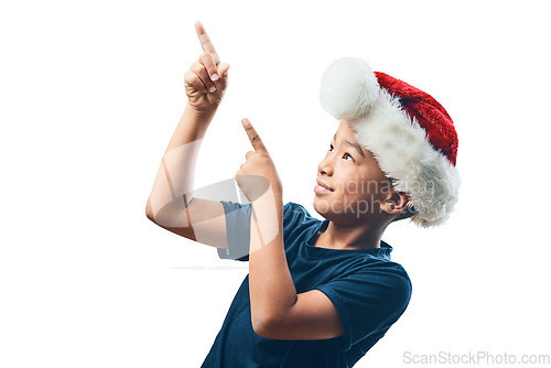 Image of Christmas, pointing and happy with child on transparent background for celebration, advertising and show. Promotion, festive holiday and xmas with young boy isolated on png for hand gesture and deal