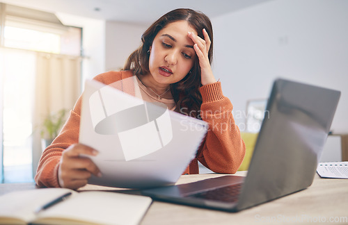 Image of Documents, stress and woman on laptop in home with paperwork for online banking, finance and taxes. Remote work, worry and female person with computer for debt payment, financial report and bills