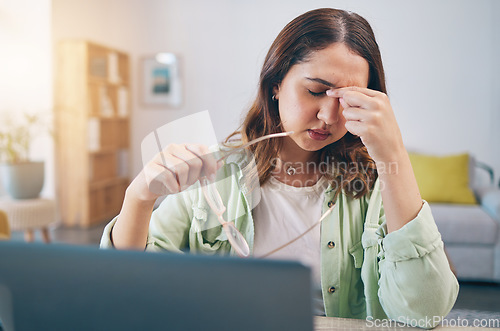 Image of Headache, stress and woman on laptop in home with deadline for project, report and online task. Remote work, overworked and female person with burnout, frustrated and worry for freelance business