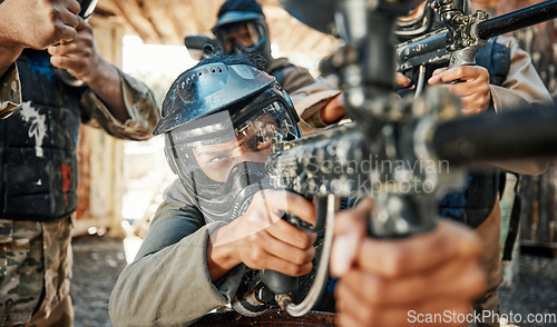 Image of Paintball game, gun and man aim, shooting focus and target soldier, warrior or training for battlefield fight conflict. Army mission, military teamwork and team point weapon in war, action or battle