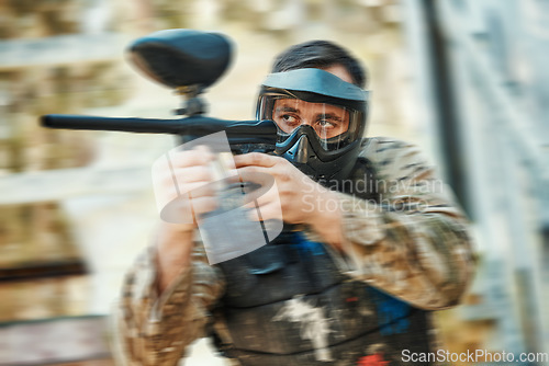 Image of Paintball gun, focus and man aim, shooting and target soldier, action warrior or training for battlefield fight conflict. Army mission gear, blur and male shooter in war, battle or military practice