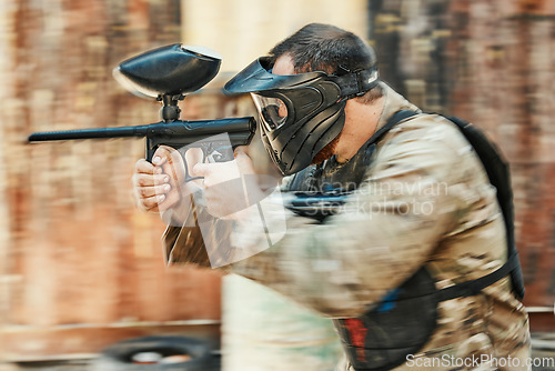 Image of Paintball gun, motion blur or man shooting competition, aim and target soldier, tactical survival training or active hobby game. Outdoor adventure, rifle gear or male shooter focus on conflict battle