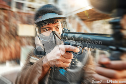 Image of Paintball, blur and man in action with gun for tournament, competition and battle in nature. Camouflage, sports and male person shooting in outdoor arena for training, adventure games and challenge