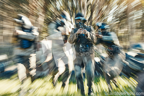 Image of Fast, sports and paintball with man in game for playground, motion blur and gaming. Challenge, mission and soldier action with people shooting in battlefield arena for target, gun or warrior training