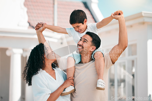 Image of Happy, love and young family bonding outdoor in the backyard of their modern house. Happiness, smile and boy child playing with his parents in the outside garden for fresh air by their new home.