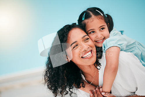 Image of Love, piggyback and mother with her girl child in the outdoor garden at their family home. Happy, smile and young mom carrying her kid on his back while bonding and playing together in the backyard.