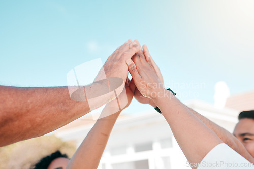 Image of Business people, high five and hands in support of partnership, success or deal celebration outdoor. Team building, teamwork and group celebrating collaboration, motivation or goal, vision or target