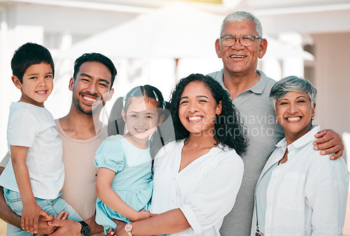 Image of Happy, excited and portrait of big family together in the backyard of their modern house. Happiness, smile and children bonding and posing with their grandparents and parents in garden by their home.