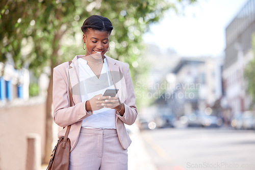 Image of Business woman, phone and typing outdoor on a city road for communication, network or chat. Black female entrepreneur with a smartphone on a sidewalk for internet connection, message or travel app