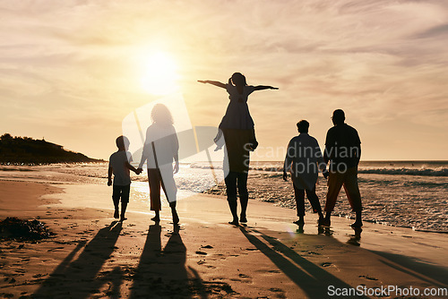 Image of Silhouette, family is walking on beach and back view with ocean waves, sunset and bonding in nature. Generations, people outdoor and tropical holiday, freedom and travel with trust and love in Mexico