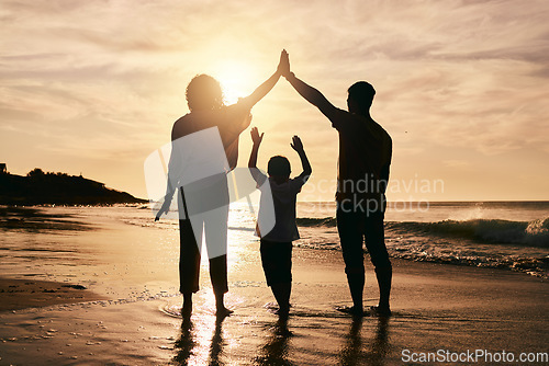 Image of Silhouette, family and protection, beach at sunset with parents and child, safety and ocean waves. Bonding in nature, insurance and people outdoor, tropical holiday and travel with trust and love