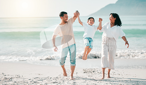 Image of Holding hands, dad or mother playing child at beach with a happy family for holiday vacation travel in nature. Jump, parents or mom lifting child with dad walking at sea or ocean bonding together