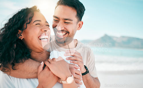 Image of Love, happy and travel with couple on beach for lens flare, summer and vacation together. Peace, smile and relax with man and woman hugging on date for seaside holiday, care and mockup space