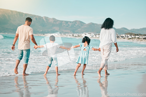 Image of Hand holding, family is walking on beach and back view with ocean waves, summer and bonding in nature. Parents, children and people outdoor on holiday, freedom and travel, trust and love in Mexico