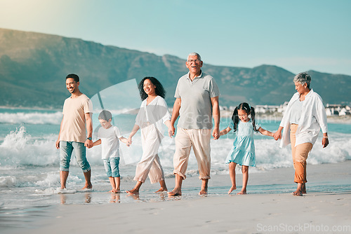 Image of Holding hands, family is walking on beach and ocean, generations and bonding in nature with waves. Grandparents, parents and kids, people outdoor and travel with trust and love on Mexican holiday