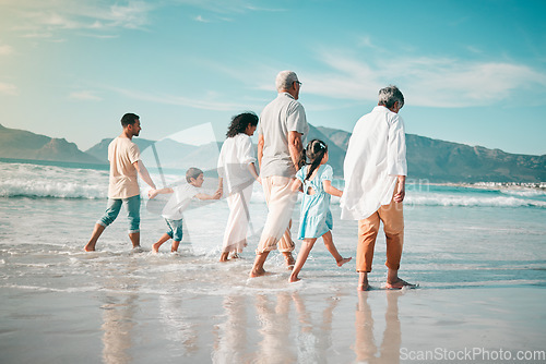 Image of Holding hands, family is walking on beach with ocean and back view, solidarity and bonding in nature. Generations, people outdoor on tropical holiday and freedom, travel with trust and love in Mexico