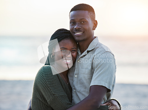 Image of Happy, black couple and portrait outdoor at the beach with love, care and commitment. Smile on face of young african man and woman together on vacation, holiday or sunset travel trip in Jamaica