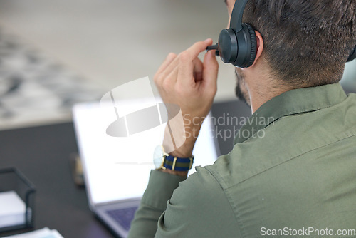 Image of Telemarketing, business and man with headphones, call center or tech support with communication. Male person, consultant or employee with a headset, customer service or help desk with sales or laptop