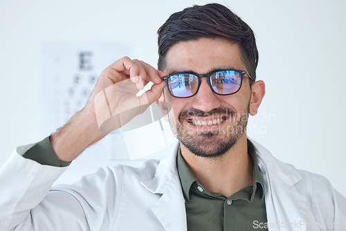 Image of Face, man and optometrist smile with glasses for vision, healthcare or wellness. Portrait, happy and doctor of ophthalmology with frame, expert optician or medical professional for eye care in clinic