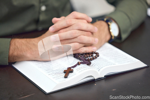 Image of Bible, cross and hands, person praying with religion, faith and gratitude with trust in God. Crucifix, rosary beads and Christian holy book, spiritual and Jesus with prayer, belief and worship