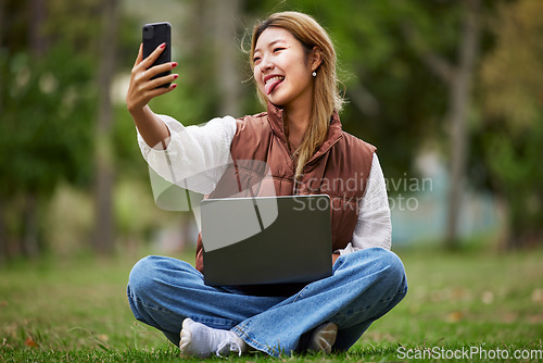 Image of Selfie, asian and woman student in a park to update social media while outdoor studying and learning online. Internet, web and young person or influencer takes picture in nature for peace and calm