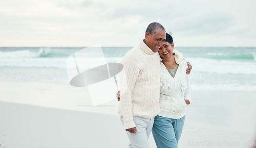 Image of Senior couple, hug and beach walk together with funny moment, comic memory or conversation by sea. Happy retirement, ocean and outdoor embrace with love, bond or romance for laugh by waves on holiday