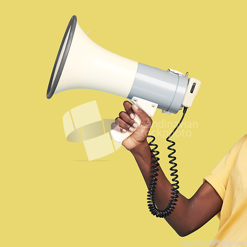 Image of Black woman, hands and megaphone on mockup for announcement, advertising or marketing against a yellow studio background. Hand holding bullhorn for loud voice, speech or news on mock up or copy space