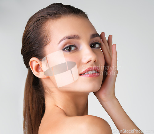 Image of Beauty, skincare and confident with portrait of woman for cosmetics, natural and attractive. Vitality, glow and fresh treatment with face of model for self care, makeup or radiant on grey background