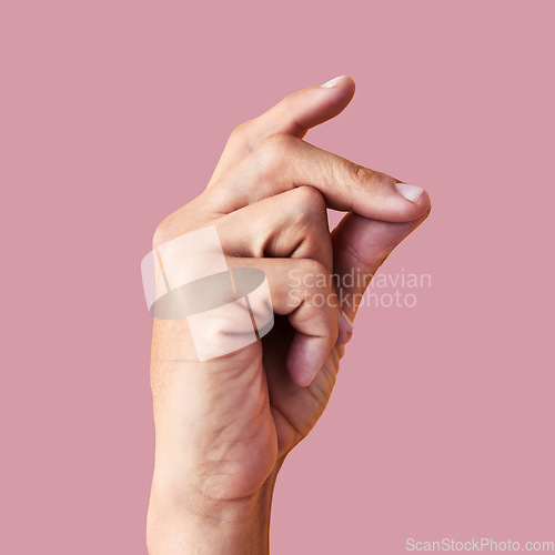Image of Click, finger snap and hand of man in studio for attention, ok and idea expression isolated on pink background. Sound, natural and yes with person and flick gesture for action, success and easy