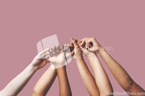 Image of Hands, support and people in unity, togetherness and solidarity on pink studio background. Women outreach, hand and friends group and team, teamwork or diversity, collaboration and trust isolated