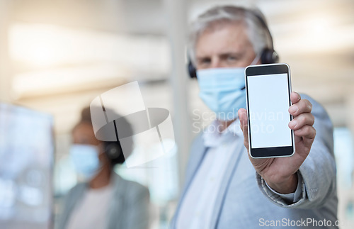 Image of Phone, mockup and a man consultant in a call center for customer service or helpline support. Ecommerce, contact and website with a male telemarketing employee consulting while working in sales