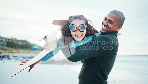 Image of Beach, black family and daughter flying with her father while playing fantasy or pretend with imagination. Portrait, fun or plane with a man parent and girl child pilot bonding through play