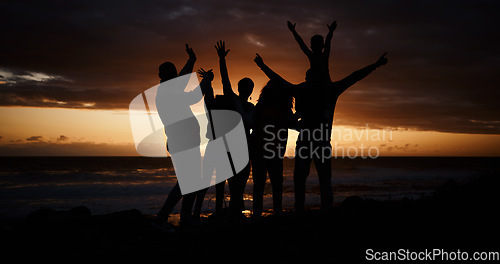 Image of Freedom, sunset and silhouette of people at the beach while on a summer vacation, adventure or weekend trip. Carefree, happy and shadow of group of friends having fun together by the ocean on holiday