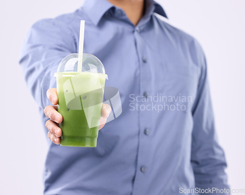 Image of Smoothie drink in man hands isolated on white background for diet, detox and healthy breakfast offer. Person or nutritionist hand holding or giving green juice for healthy or vegan protein in studio